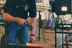 Troy forging at an American Farrier's Team practice