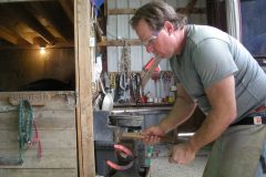 Dru shaping a hot horseshoe