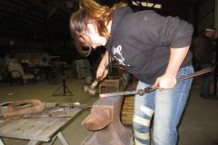 Zoe forging a heel for a handmade shoe