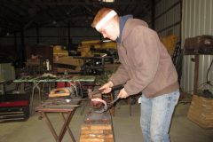 Jayson forging a handmade hind shoe