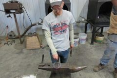 Jayson checking an egg bar shoe for balance